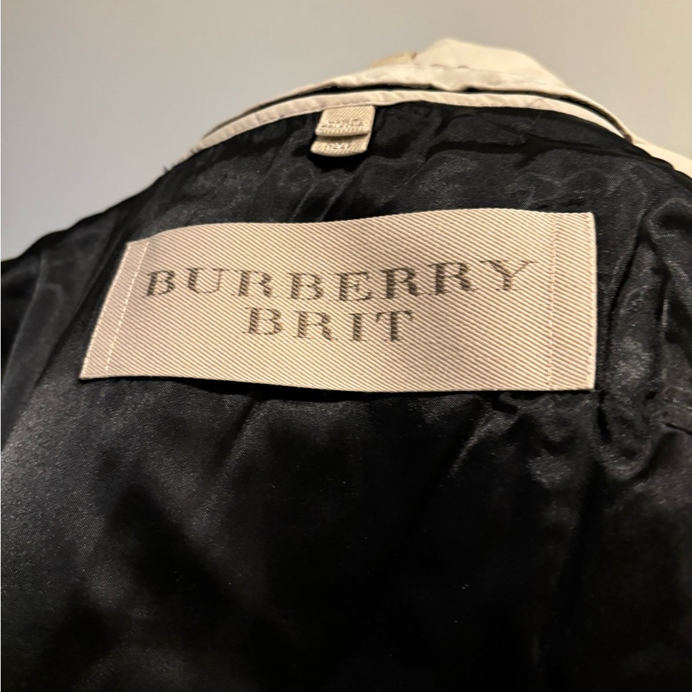 Rain Jacket by Burberry with wool lining. Great condition and great quality.